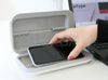 Lexuma-XGerm-Pro-Compact-Phone-UV-Sanitizer-putting phone