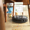 iRobot-Roomba-i7-Wi-Fi-Connected-Robot-Vacuum-Cleaner-listing-under-table